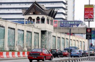 Driving past Pudu Jail side wall on Jalan Pudu will be a distant memory soon for city dwellers after tonight's demolition. - Picture by Choo Choy May
